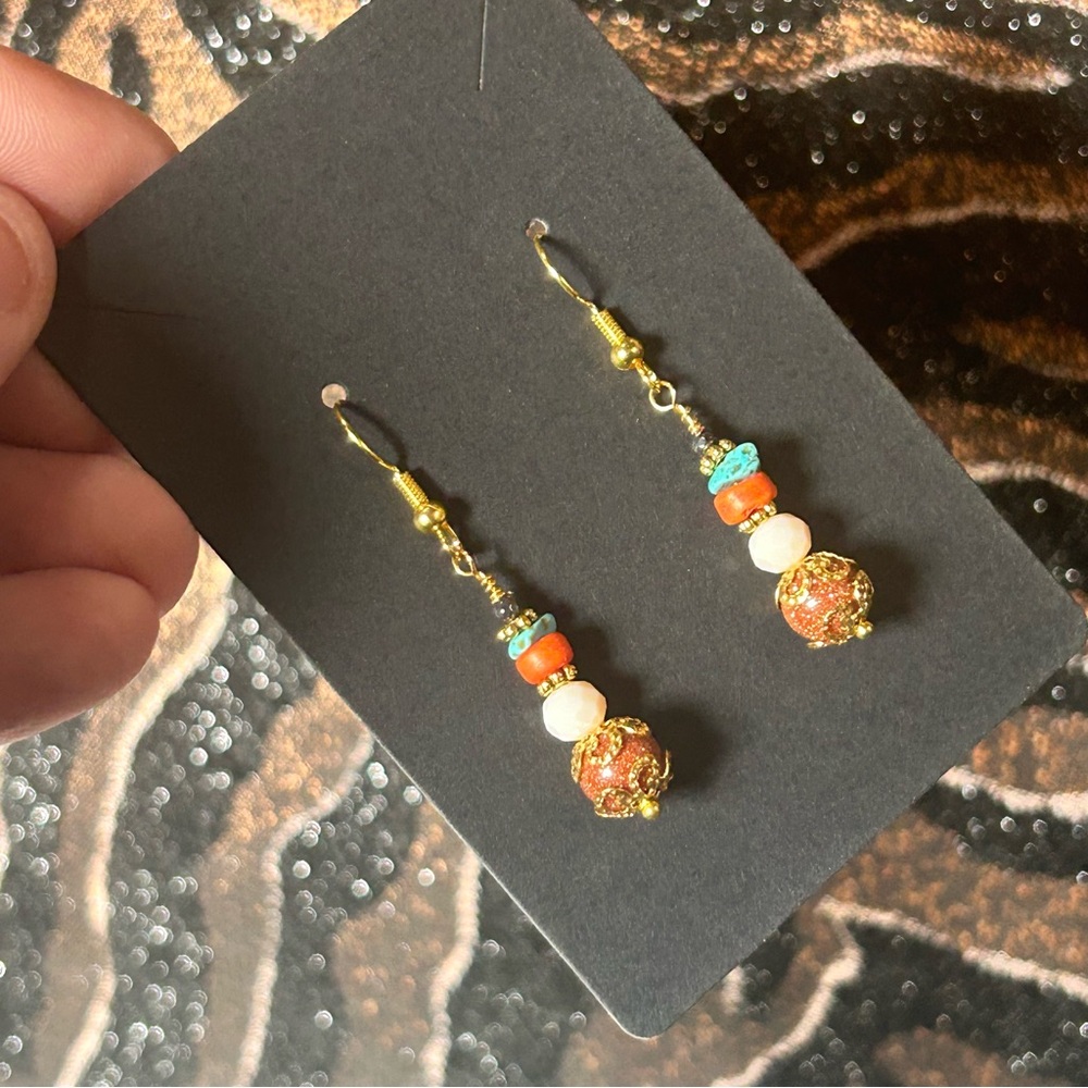 Handcrafted elegant filigree goldstone coral howlite earrings